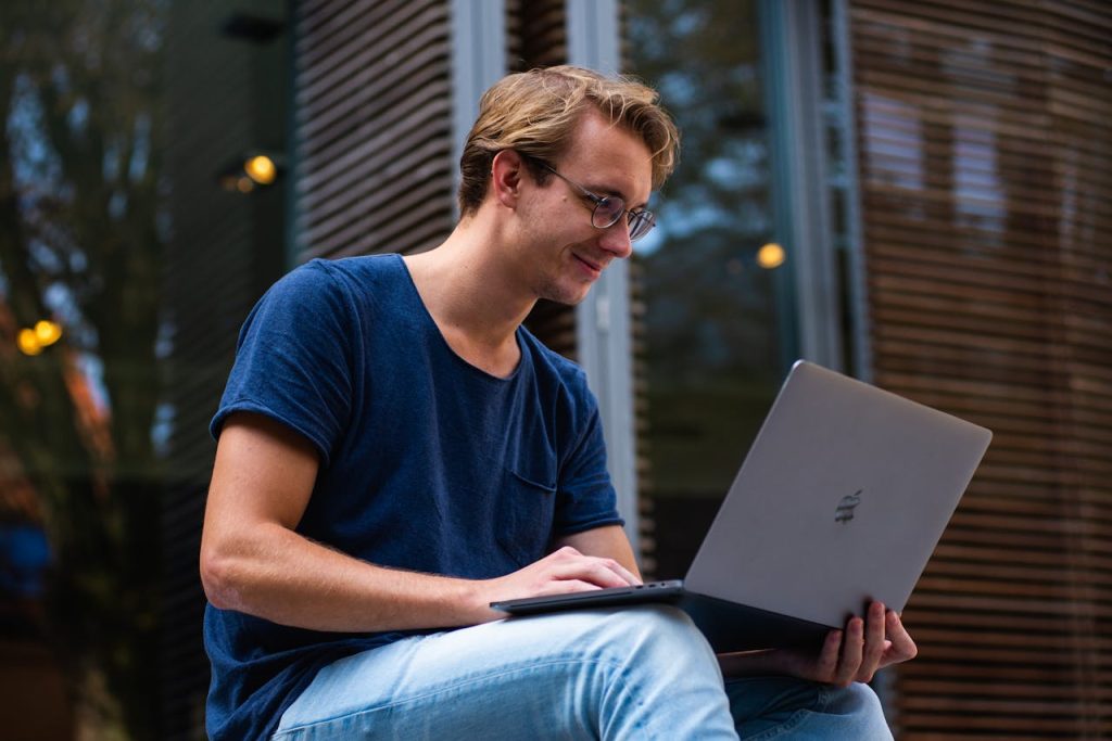 selective-focus-photo-of-man-using-laptop-1438081 A young man sitting outdoors in Leiden, Netherlands, working on a laptop.
